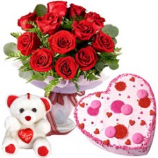 Graceful 12 Dutch Red Roses with Teddy Bear and 1/2 Kg Heart Shaped Cake